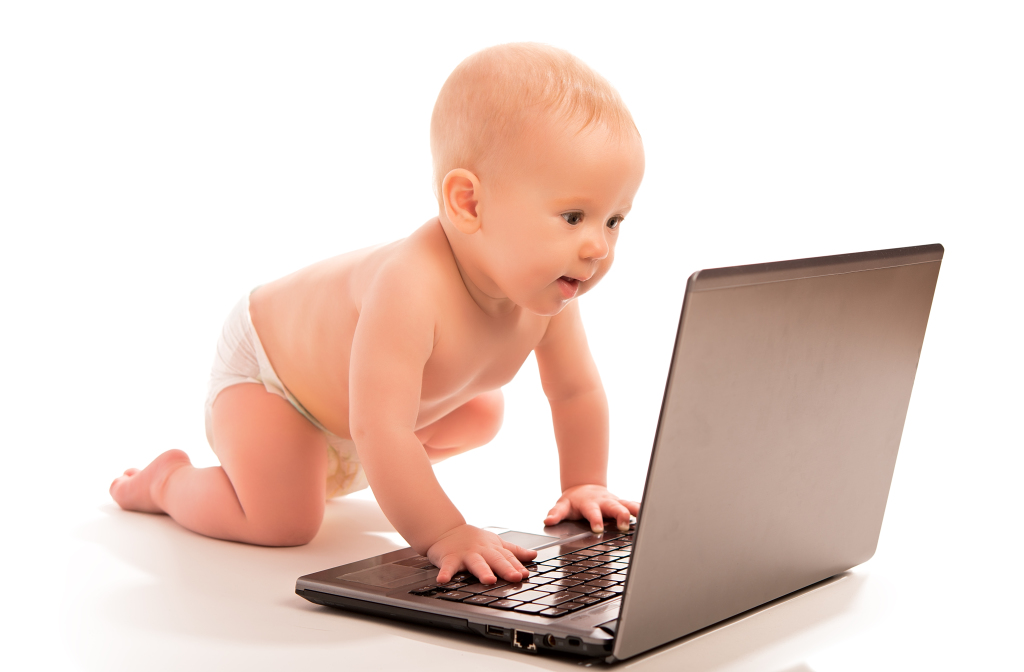 Baby And A Laptop Computer Isolated